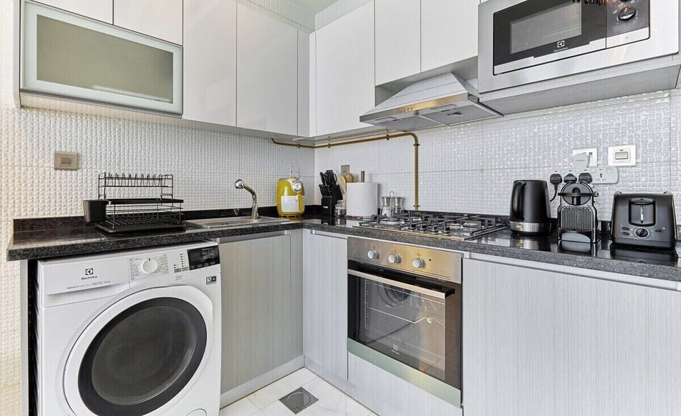 Gather around the kitchen island for casual meals or a spot of work, designed for both function and style.