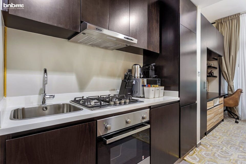 Kitchen: "Prepare delicious meals in our fully-equipped kitchen, complete with modern appliances for your culinary needs."
