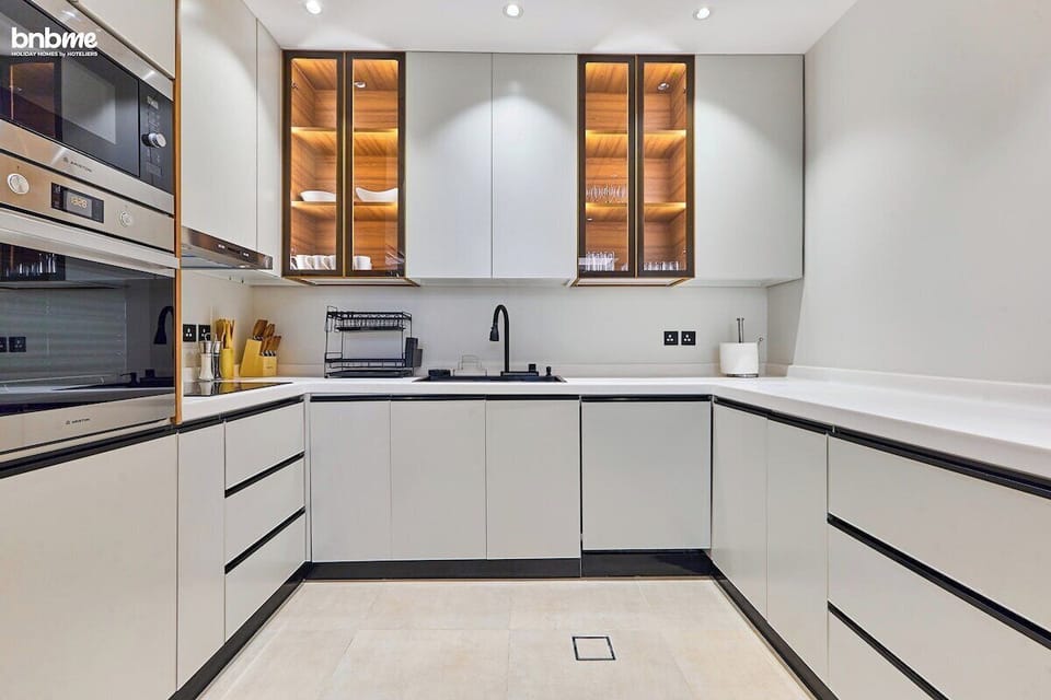 Fully equipped kitchen with modern appliances, sleek countertops, and everything you need to prepare delicious meals.