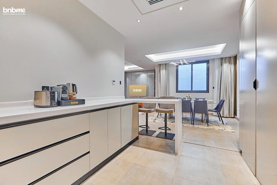Fully equipped kitchen with modern appliances, sleek countertops, and everything you need to prepare delicious meals.
