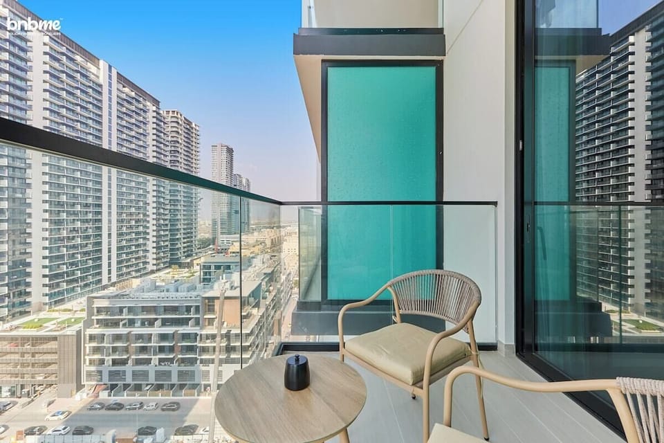Step outside onto the private balcony and take in the breathtaking city views. With comfortable seating, it's the perfect spot to unwind, sip your morning coffee, or watch the vibrant city come to life.