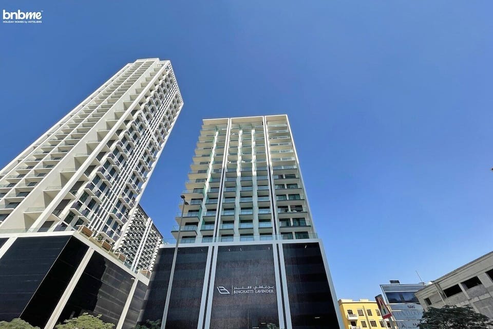 The sleek exterior of the building features contemporary architecture, with clean lines and a sophisticated design, setting the stage for your stylish urban escape.