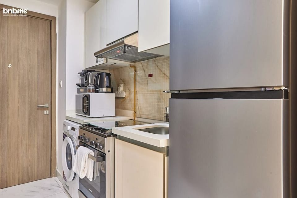 A fully equipped kitchen with modern appliances, perfect for preparing your favourite meals during your stay.
