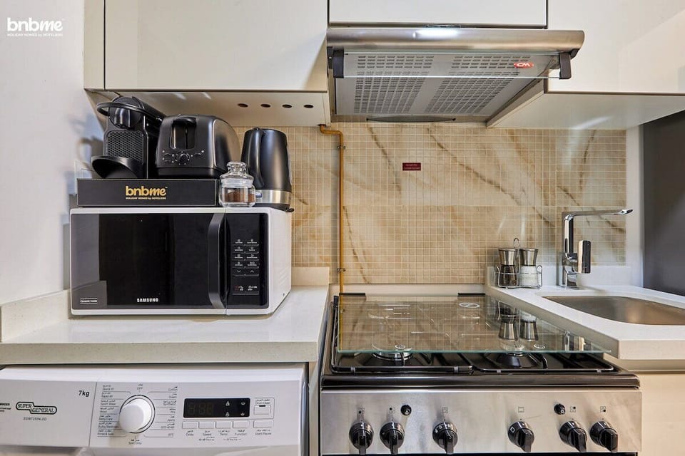 A fully equipped kitchen with modern appliances, perfect for preparing your favourite meals during your stay.