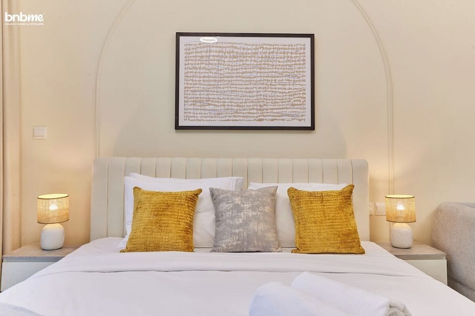 Relax in this well-designed bedroom with a plush king-sized bed, a sofa bed for additional comfort, and a TV for your entertainment.