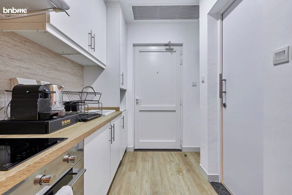 Prepare meals with ease in this stylish kitchen featuring high-end appliances and ample counter space.