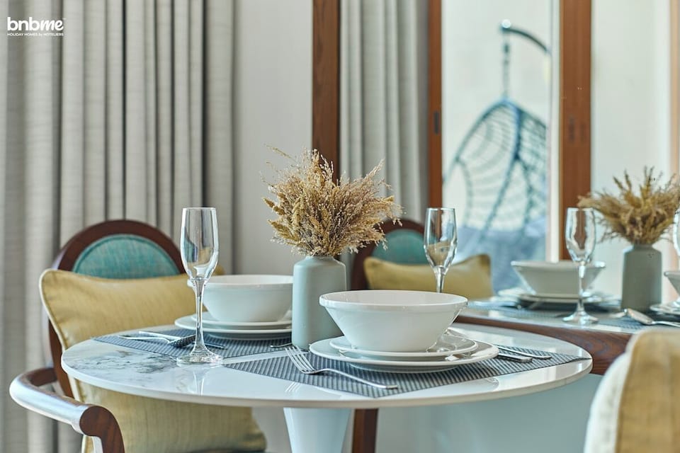 Stylish dining space set for two – perfect for enjoying a quiet breakfast or dinner.