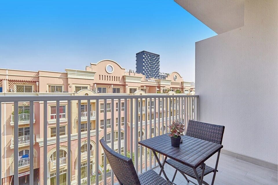 Step onto the balcony and enjoy a peaceful retreat with comfortable seating.