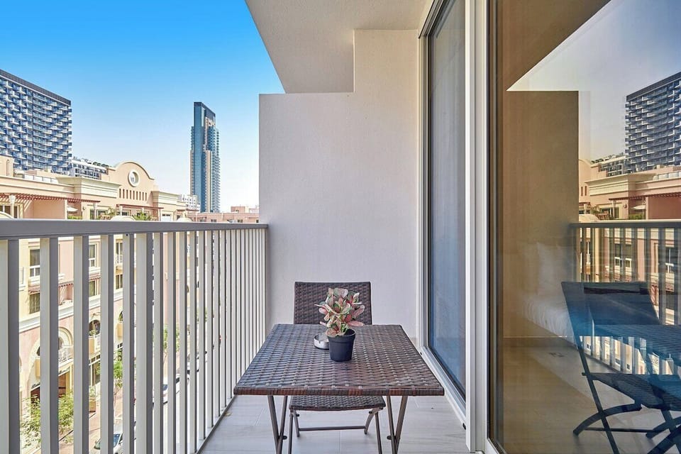 Step onto the balcony and enjoy a peaceful retreat with comfortable seating.