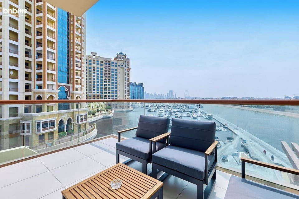 Relax on the private balcony with a seating area and stunning views of the sea and Ain Dubai.