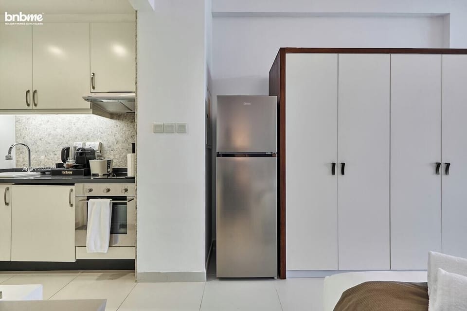 Prepare meals effortlessly in this elegant kitchen with high-end appliances and plenty of counter space.