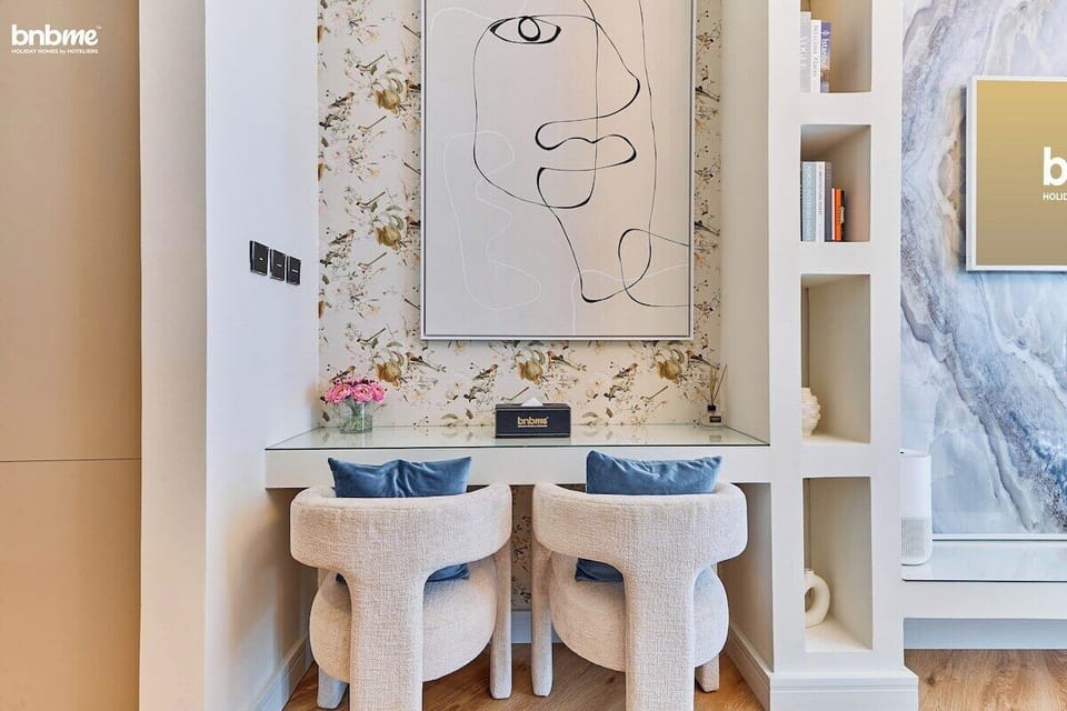 A chic and multifunctional space perfect for both work and dining. Whether you're catching up on emails or enjoying a cozy meal, the elegant glass-top table, plush seating, and artistic decor create a stylish and comfortable setting