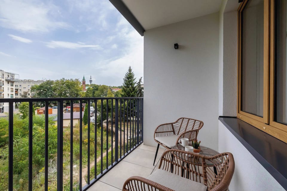 A private balcony with a view of the peaceful neighborhood.