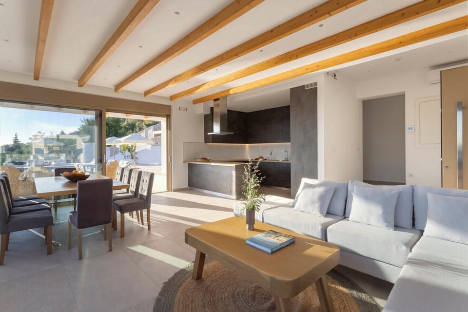 The bright, open-concept living and dining area on the upper level.