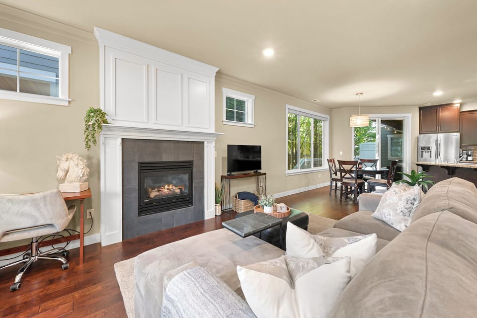 Cozy up by the gas fireplace in the inviting living room, perfect for cool Pacific Northwest evenings.