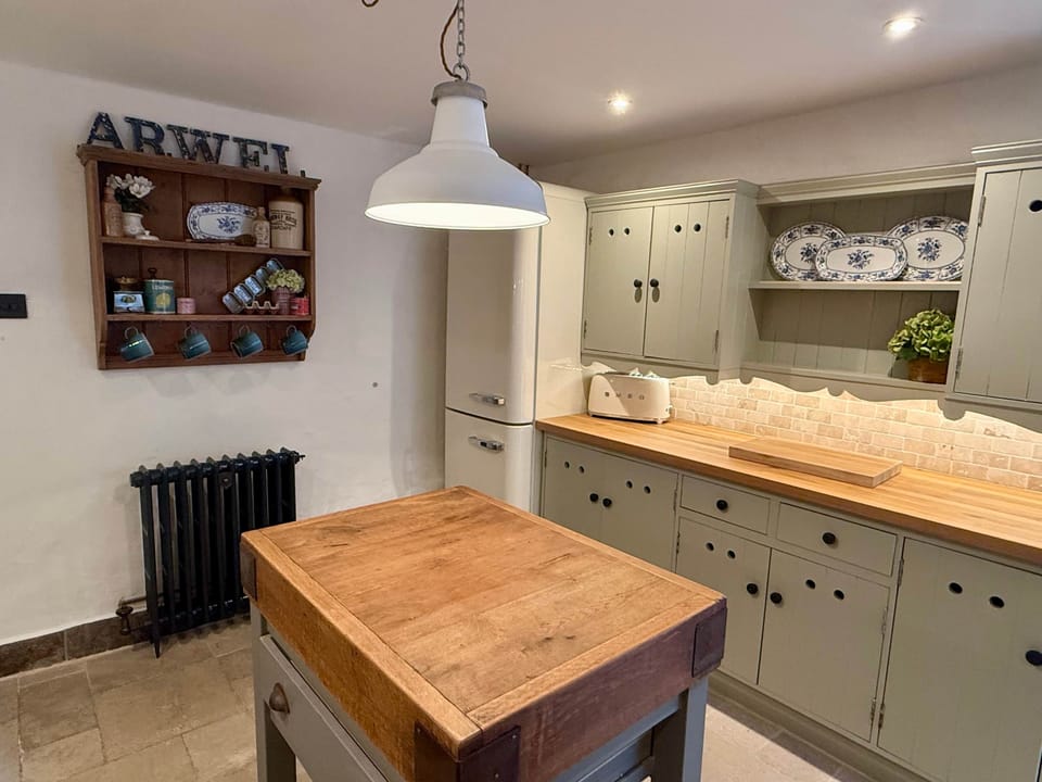 Traditional kitchen with modern appliances in Arwel Cottagege