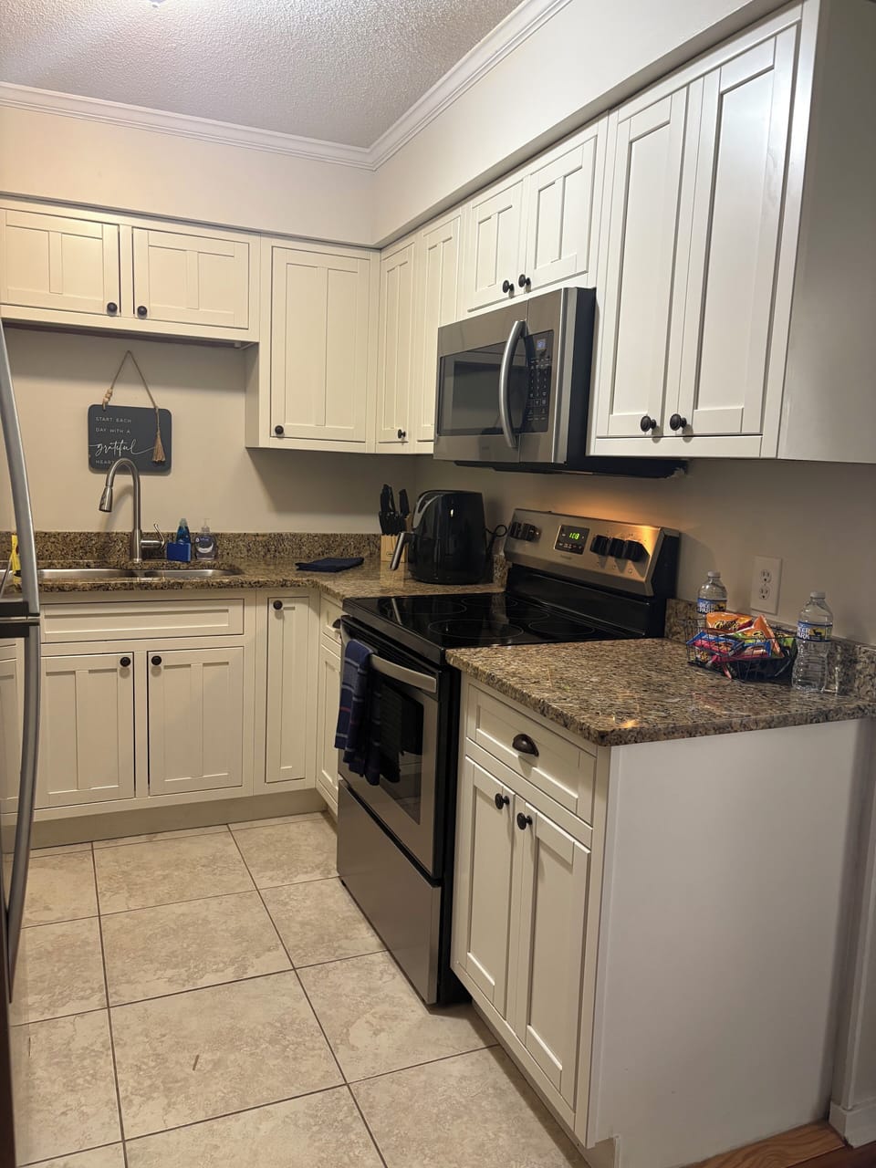 Fully stocked kitchen, microwave, Keurig, air fryer, and basic cooking supplies