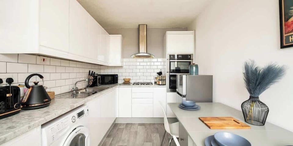 Kitchen: Modern elegance awaits with sleek appliances and a stylish dining space!