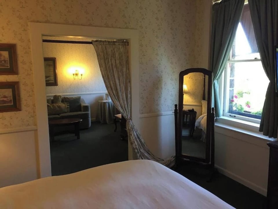 Step into a quiet bedroom retreat beside the sitting room.