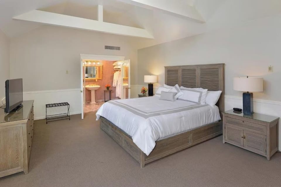Stretch out in a spacious room with calming neutral tones.