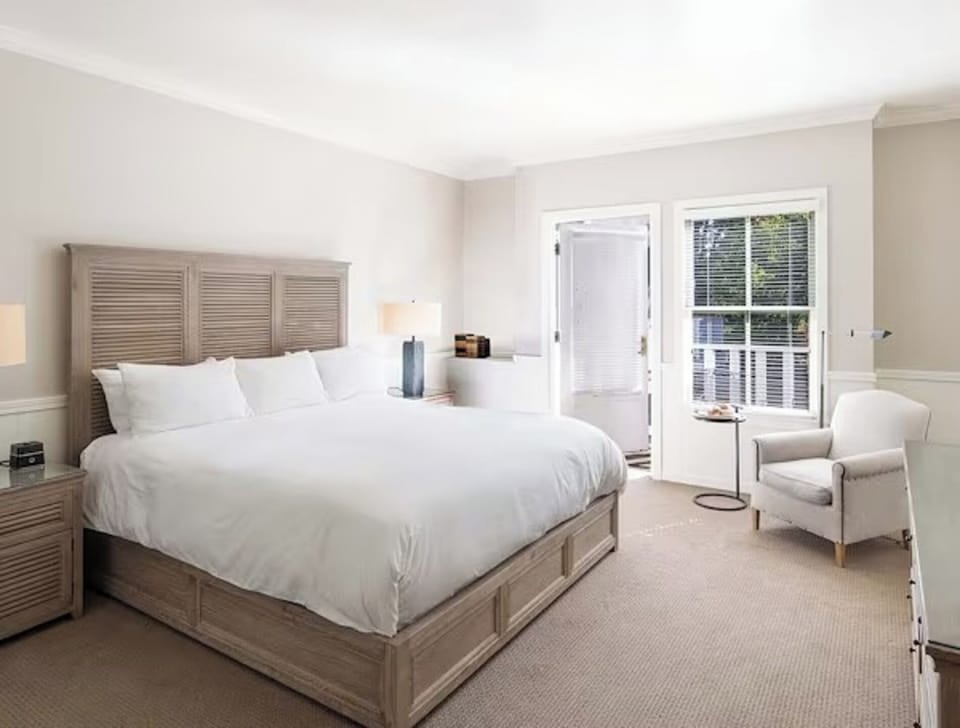 Unwind in crisp linens and sunlit comfort after exploring.