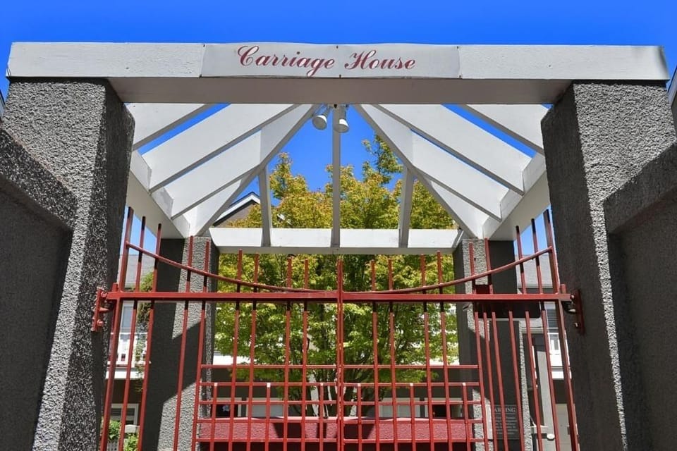 Arrive in style beneath the charming Carriage House entryway.