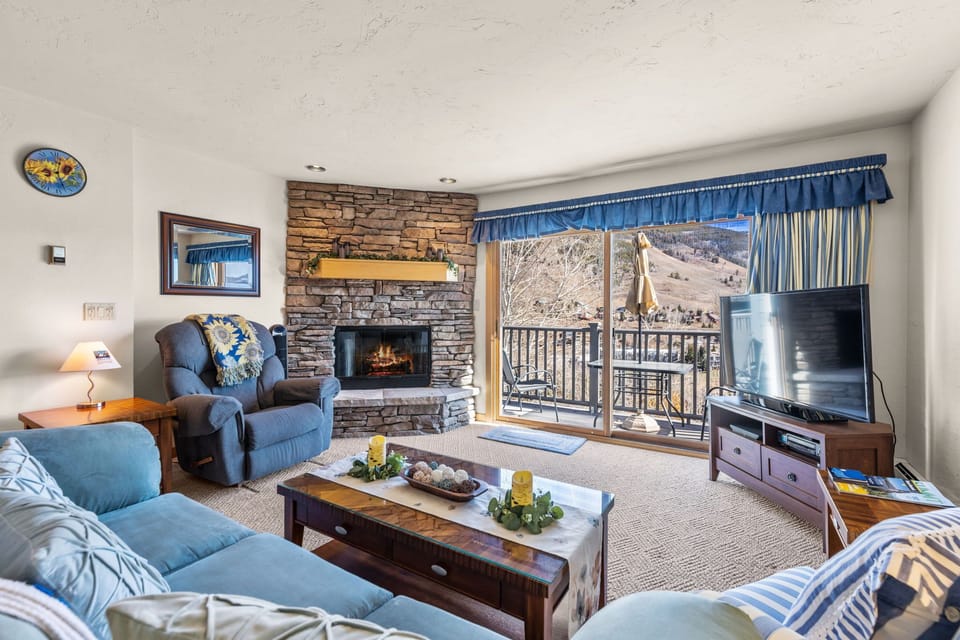 Living area with smart TV and gas fireplace.