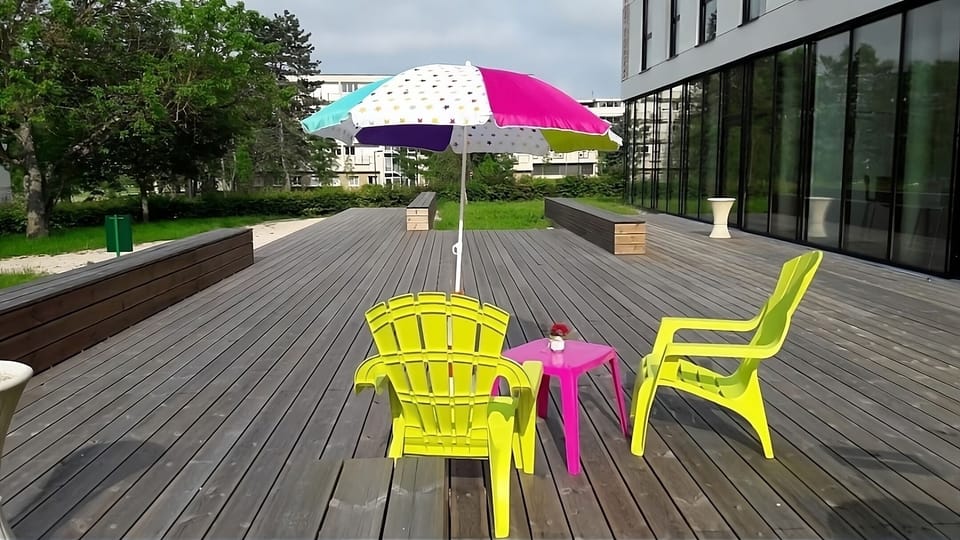 Stretch out under the umbrella and enjoy fresh air.