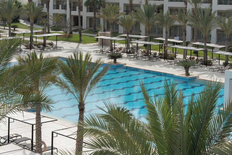 Drift into vacation mode beside the serene blue water.