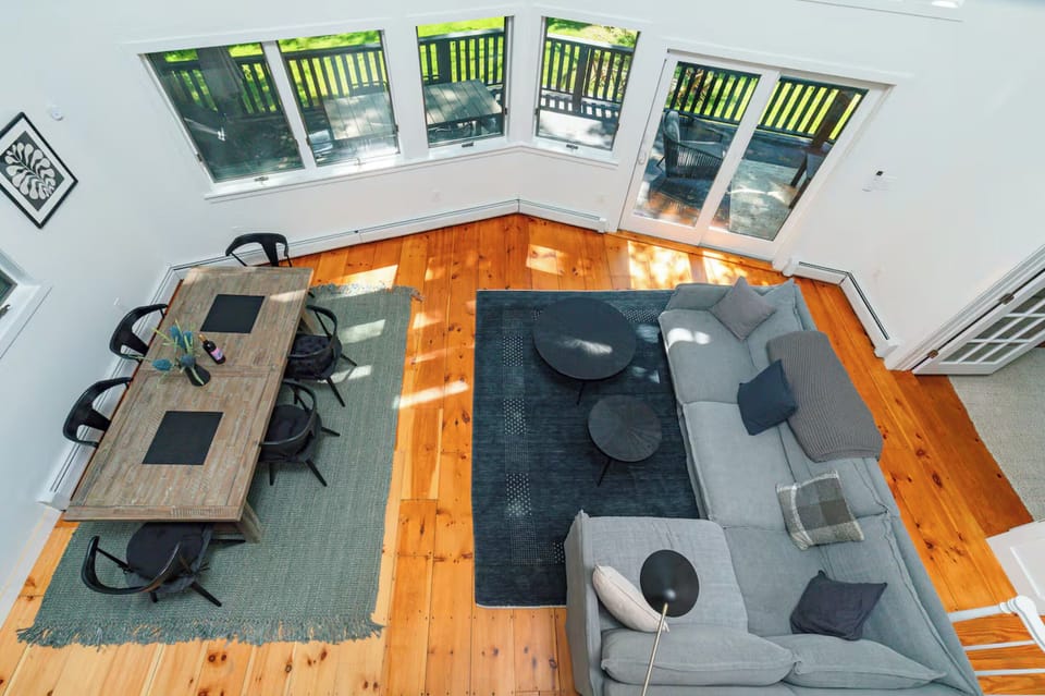 Combined living and dining area with access to the deck