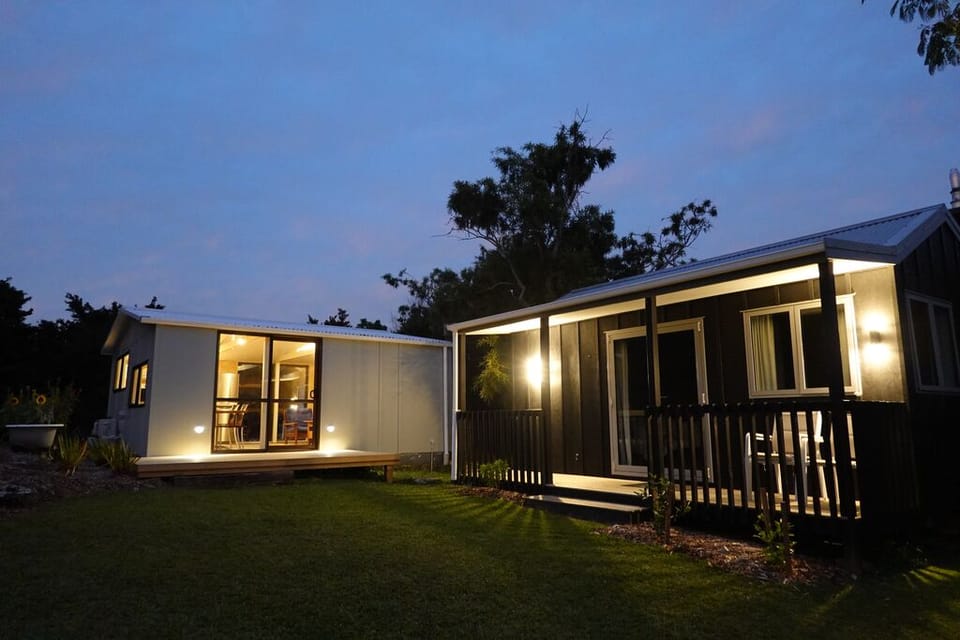 Living Shed and Queen Cottage at dusk