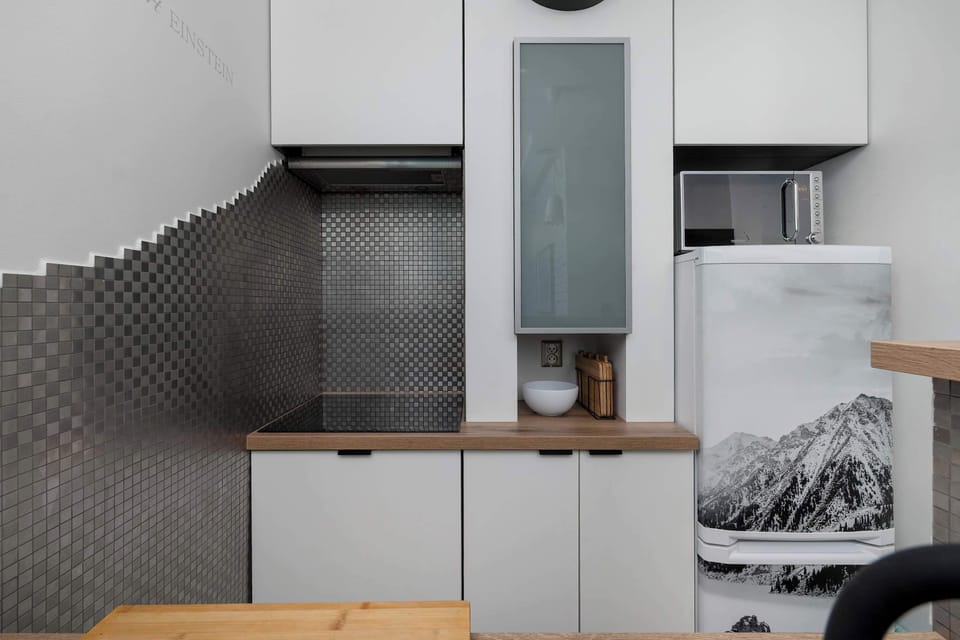 White kitchen cabinetry with a practical layout makes everyday cooking easy and convenient.
