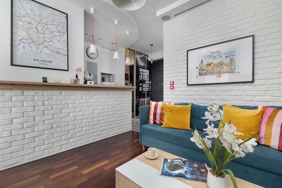 A small bar separating the kitchen from the living room adds a loft-style touch and encourages shared moments.