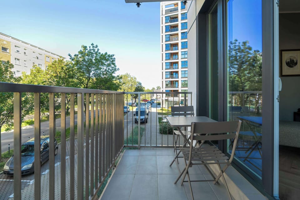 The balcony's stylish design complements the apartment's decor.