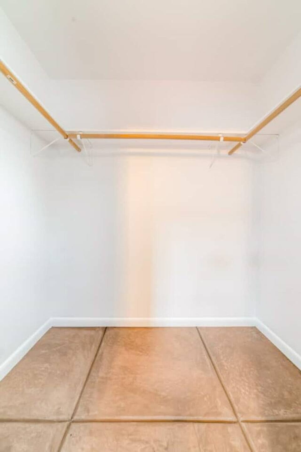 Primary bedroom`s generous walk-in closet with ample hanging space for longer stays