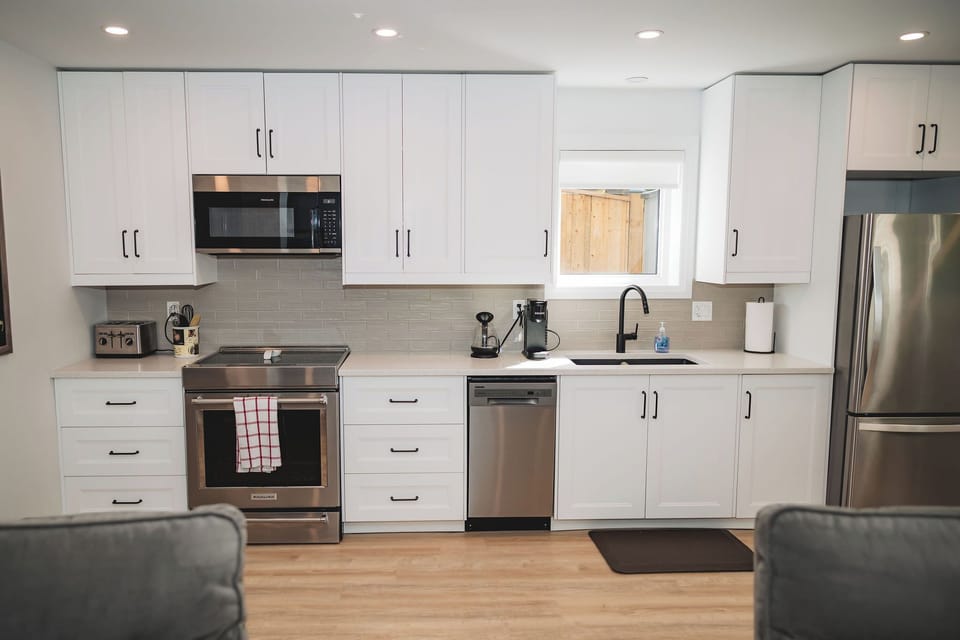 Full fridge and stove, small dishwasher