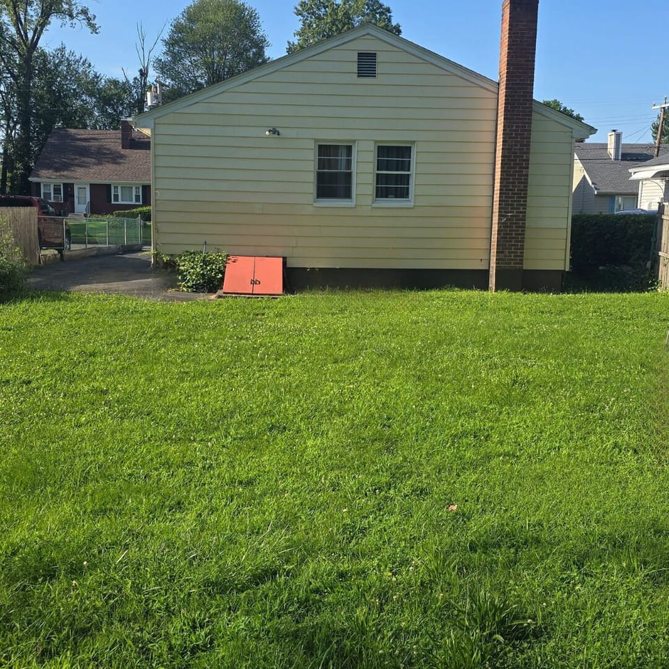 Outdoor seating area in a peaceful, quiet neighborhood setting.
