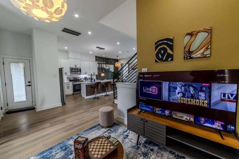  Colorful Game Room with Extra Sleeping Space
-Smart TV for movie nights, gaming  and streaming favorite shows
-Coffee table for snacks, games, or puzzles
-Dedicated desk for remote work