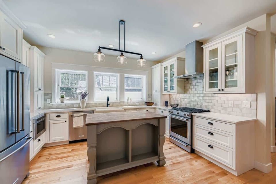 Spacious open-concept kitchen featuring modern appliances and ample workspace