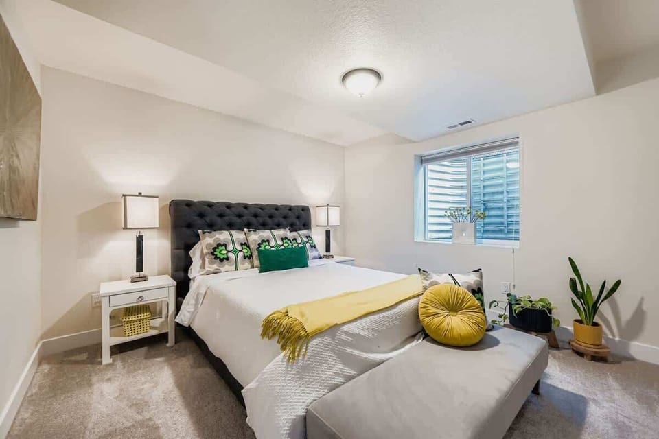 Basement bedroom with a queen sized bed 