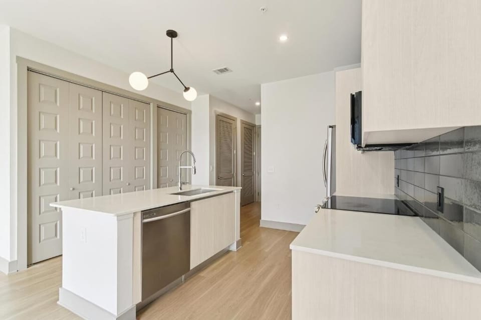 Cook comfortably with generous counters and streamlined appliances.
