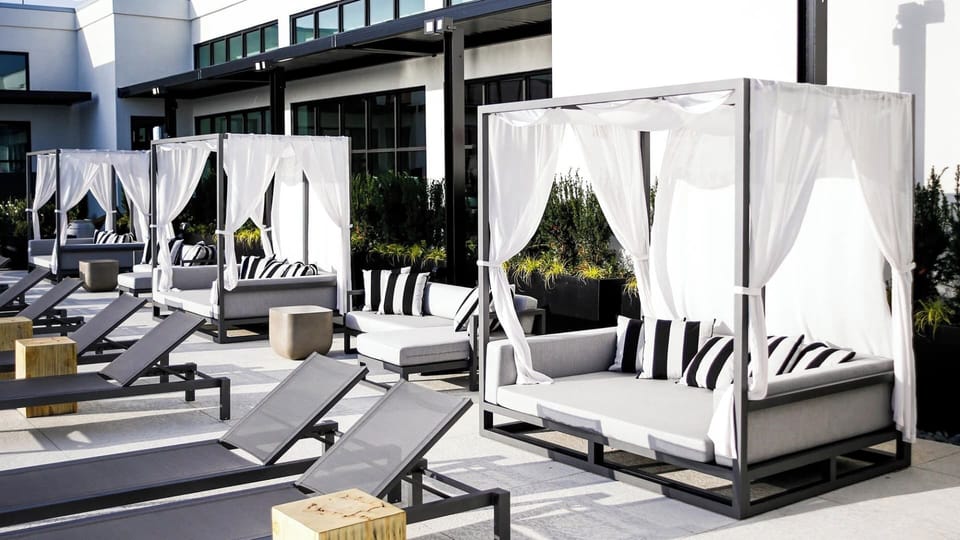 Lounge in breezy cabanas and soak up rooftop sunshine.