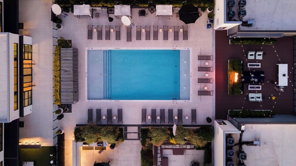 Admire the resort-style pool scene from an elevated view.