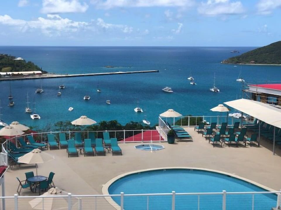 Lounge by the pool while enjoying breathtaking views of the Caribbean Sea.