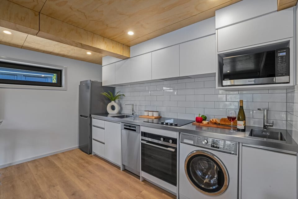 Kitchen: Whip up culinary delights in a sleek, modern space with all the kitchen necessities