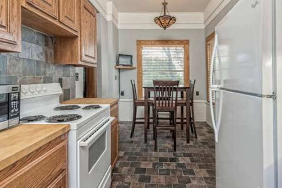 The upstairs kitchen is fully updated and stocked with everything you need to cook a meal. 