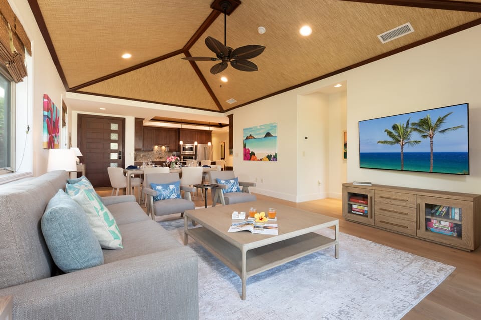 Great room with tasteful furnishings, decor and lovely woven grass cloth ceilings