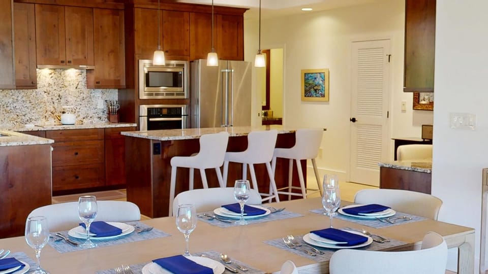 Seating for six and the dining room table, additional seating at the island