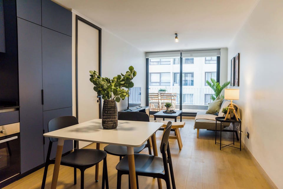 Bright and modern living area with stylish decor and ample natural light, perfect for relaxation.