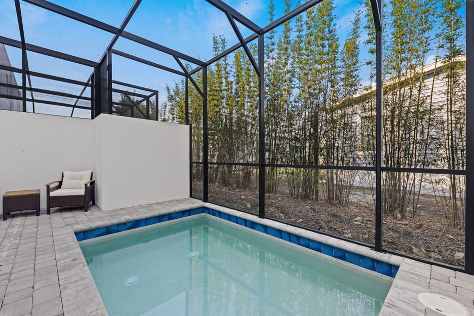 Enjoy sunny Florida days by your private pool surrounded by a wide patio and comfortable lounge chairs.